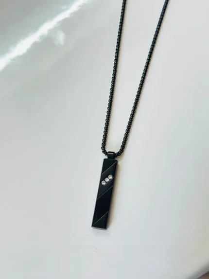 Black pendant with studded diomond